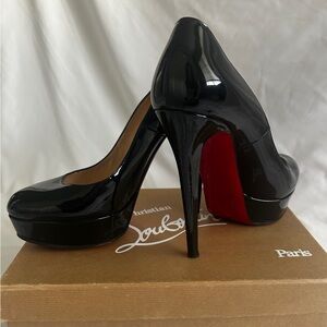 Christian Louboutin Black round toed platforms.